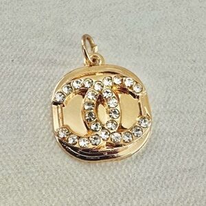 Chanel Iconic Interlocked CC in Crystals on a Gold Rounded Edge Pendant, Zipper